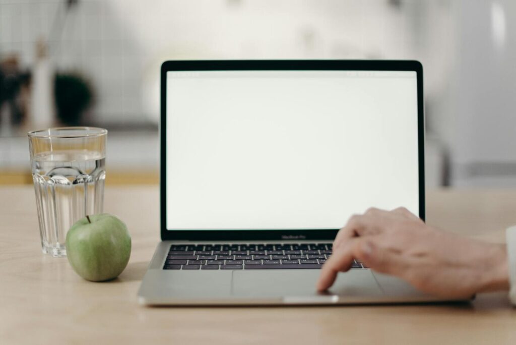 Photo Of Person Using Laptop