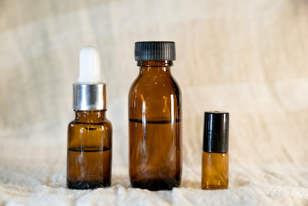 a couple of bottles sitting on top of a bed