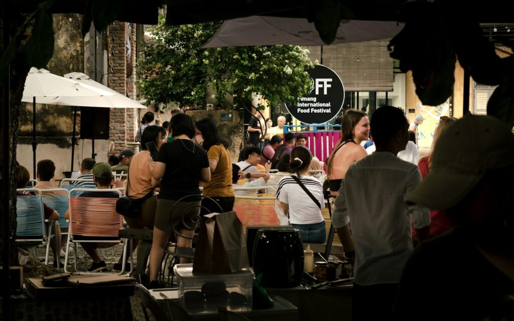 a group of people sitting around a wooden table