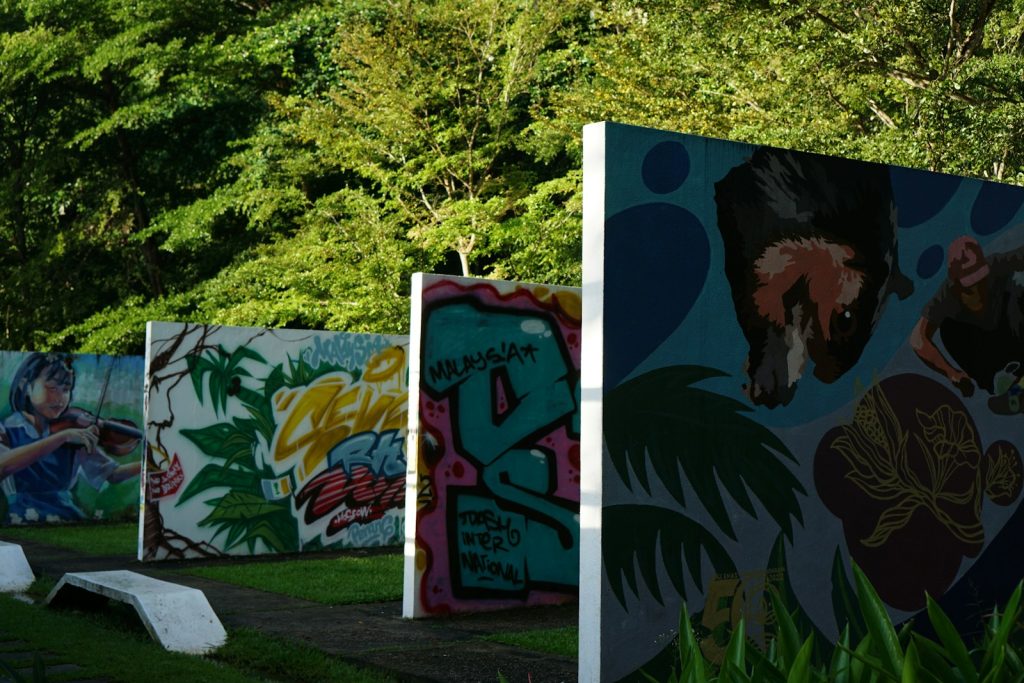 Graffiti art adorns outdoor display walls.